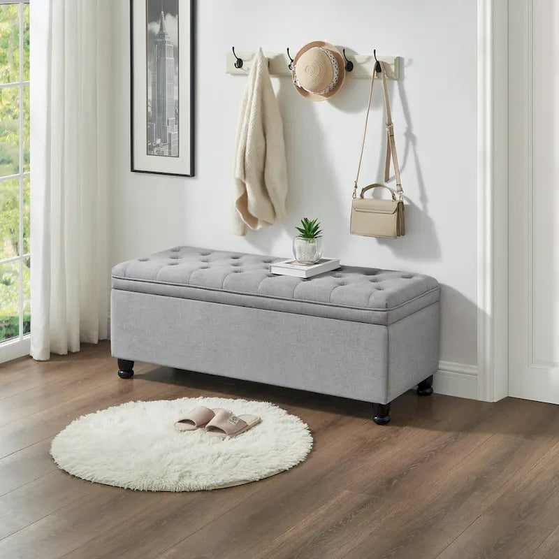 Panca contenitore con seduta trapuntata e gambe in legno