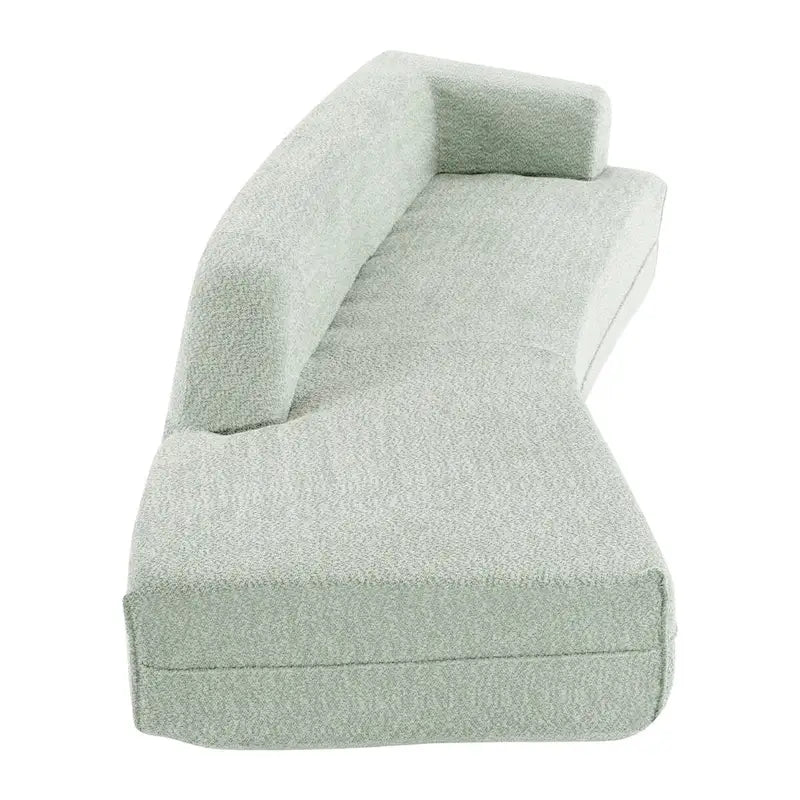 Divano curvo a chaise longue in tessuto bouclé