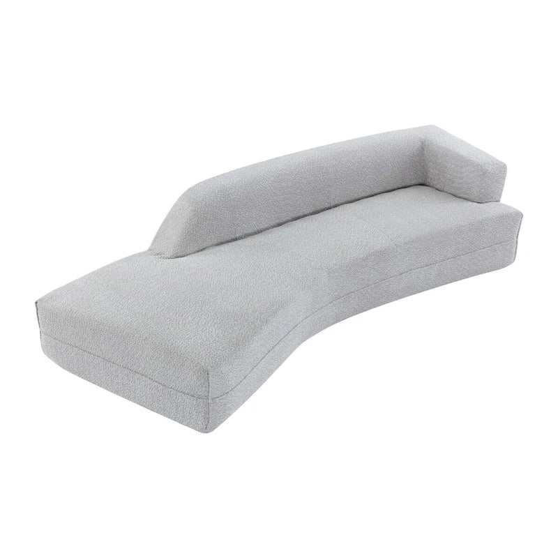 Divano curvo a chaise longue in tessuto bouclé
