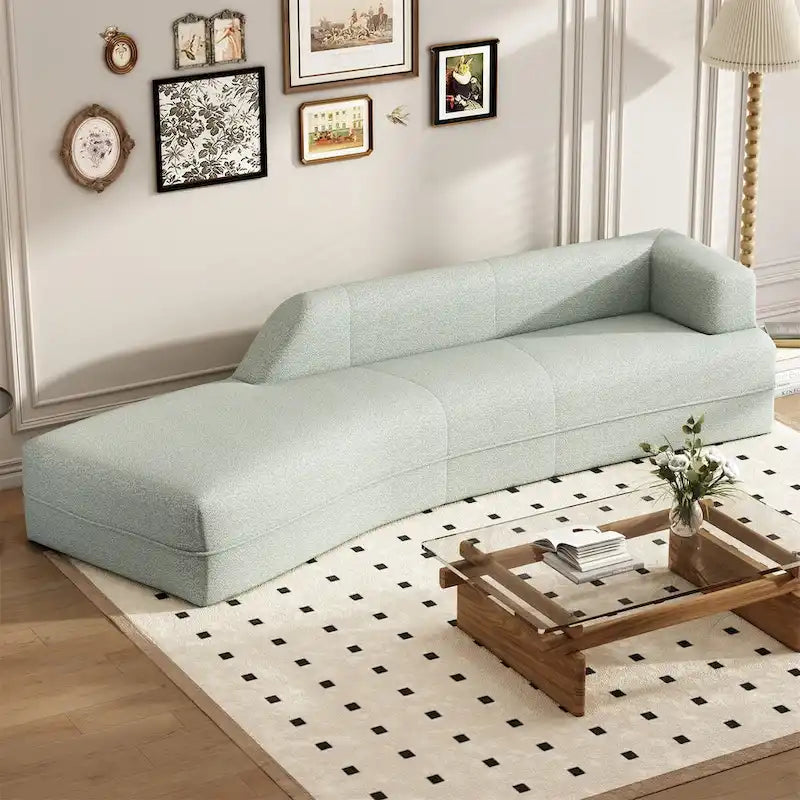 Divano curvo a chaise longue in tessuto bouclé